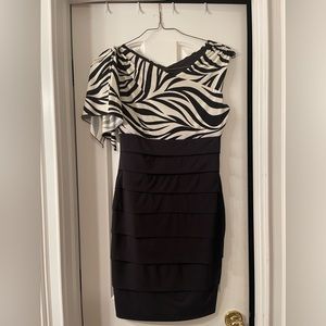 Zebra print on top, black tiered bottom. Size 8. 95% polyester, 5% spandex.